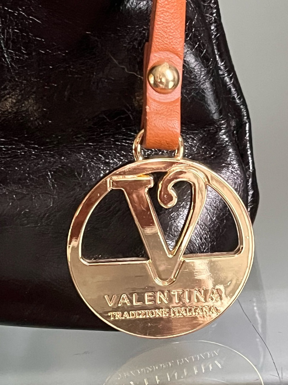 Flawless Valentina Black Patent Shoulder Bag with Tan Strap and Gold Logo Charm